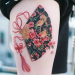 Cherry blossoms and a sparrow drawn in a fan with a red butterfly knot. #tattooistsion #flowertattoo #floraltattoo #Korea #KoreanArtist #tattooistsion #colortattoo #flower #flowers #oriental 