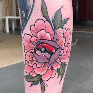 Tattoo by Adgnot Jerome #AdgnotJerome #pokemontattoos #pokemon #gamer #cartoon #tvshow #game #Japanese #anime #pokeball #peony #flower #floral #Japanese #color