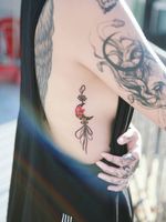 A black moon norigae with peony. #tattooistsion #flowertattoo #floraltattoo #Korea #KoreanArtist #tattooistsion #colortattoo #flower #flowers #oriental #norigae #koreatattoo 