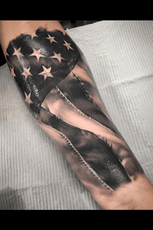 Anerican flag forearm tattoo