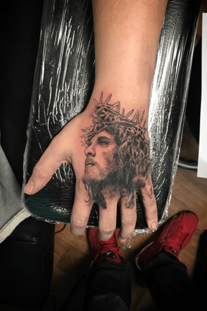 Jesus hand tattoo.
