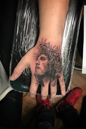 Jesus hand tattoo.