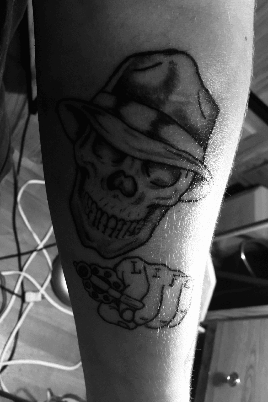 Premium Vector  Skull and gun tattoo