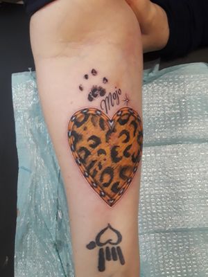 Memorial Tattoo for my cat Mojo who passed away in July, her actual paw print. Also seen is my ASL tattoo for I Love You , my daughter is deaf 