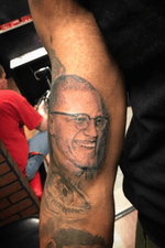 Malcolm X portrait tattoo.