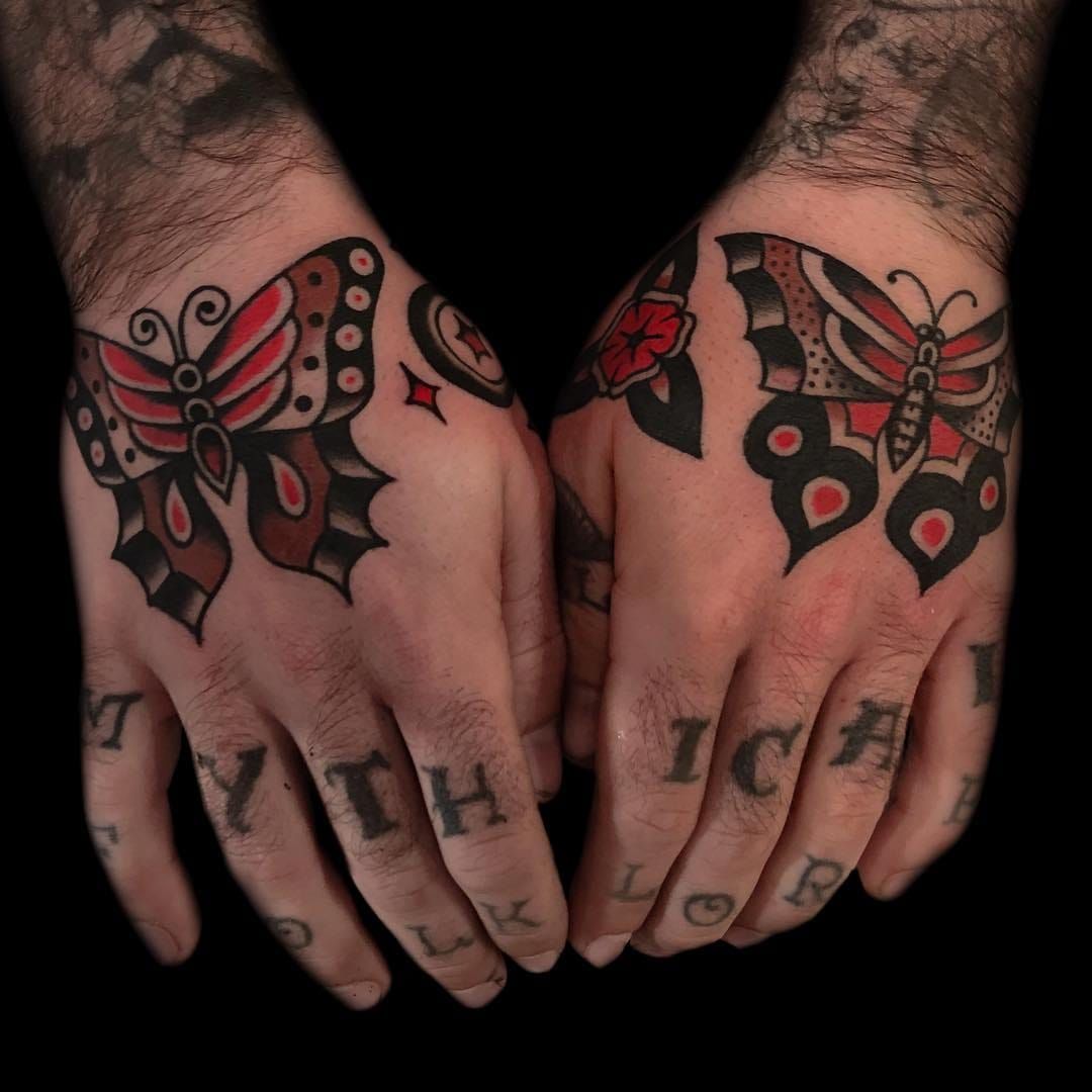 Traditional butterfly hand tattoo