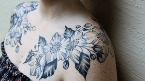 Floral chest piece on our counter gal Kenzie by Owner, Natalie Kontra