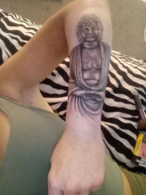 Brandon from scarred for life carrum downs did my buddah tattoo which I love an so happy with 