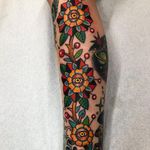 Tattoo by Robert Ryan #RobertRyan #eyetattoos #eyetattoo #eye #anatomy #color #traditional #flowers #floral #leaves #surreal #strange #thirdeye
