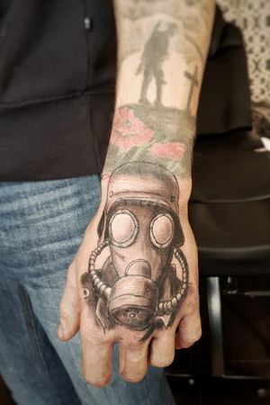 Gas mask hand tattoo