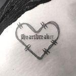 Tattoo by Emily Malice #EmilyMalice #hearttattoos #heart #love #heartbreak #linework #illustrative #barbedwire #oldenglish #heartbreaker #text #font