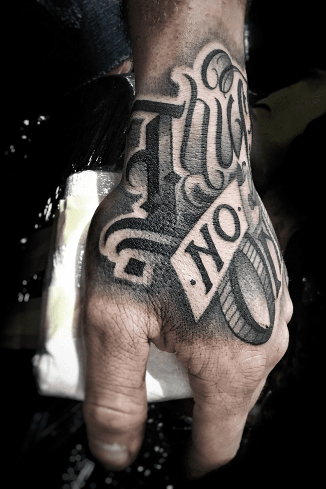 Closeup of man hand with tattoo  ID 109682731
