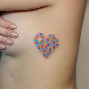 Tattoo by Yaroslav Putyata #YaroslavPutyata #hearttattoos #heart #love #heartbreak #pixel #cute #little #small #color #newschool