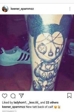 Voodoo Mickey mouse tattoo on calf