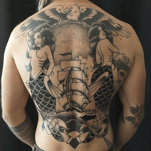 Black and grey traditional back poece by Brian Kelly