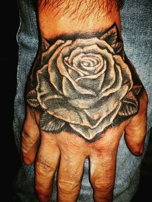 This rose is covering a large papa Smurf  #coveruptattoo #coverup #roseonhand #rose #rosetattoo #blackandgreytattoo 