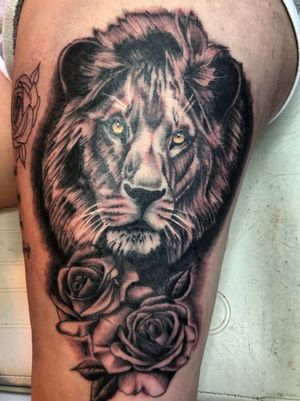 Realistic lion and roses