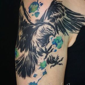 Get a stunning illustrative eagle tattoo on your upper arm in London, inspired by Japanese art style.