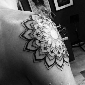 Get a stunning geometric mandala tattoo on your shoulder in London for a unique and intricate design.