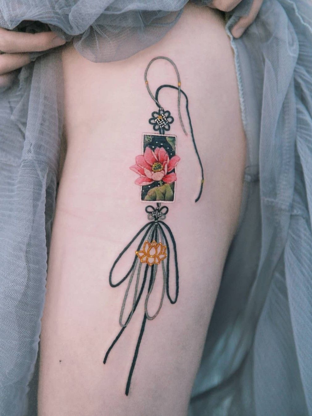 Tattoo uploaded by SION • A black-knotted lotus norigae. #tattoo #Korea  #tattooart #koreatattoo #koreatattooist #flowertattoo #illustration  #birthflowertattoo #tattooistartmag #hongdae #flowers #coloredtattoo  #lotusflower #watercolortattoo ...