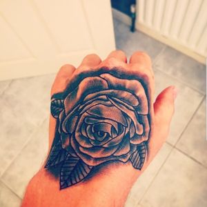 Rose hand tattoo #traditional #common #blackandgrey #rose #flowers #hand #hadtattoo 