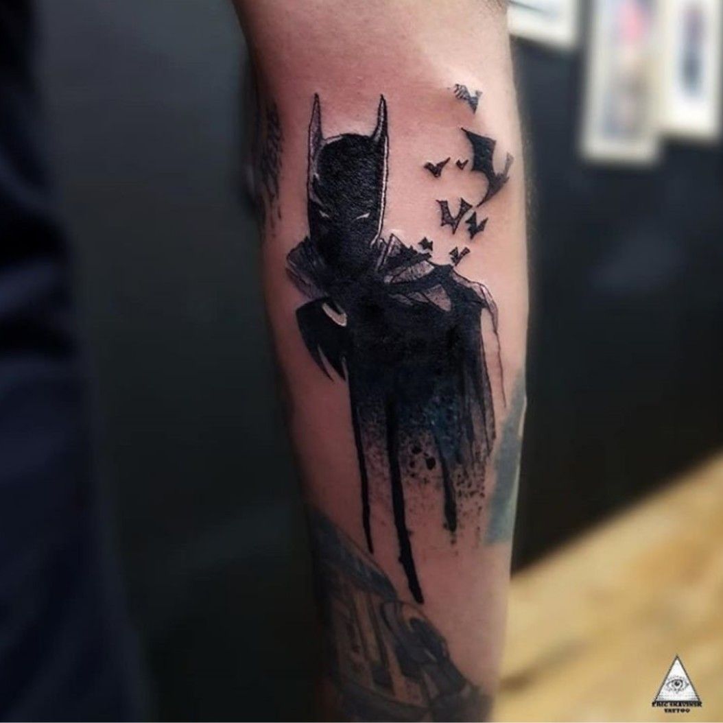 Batman tattoo on the left upper arm