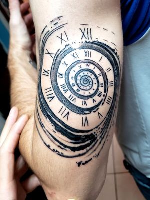 Swirling clock tattoo