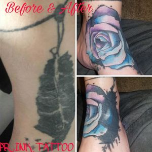 Cover up of s fake feather with a water color base flower tattoo