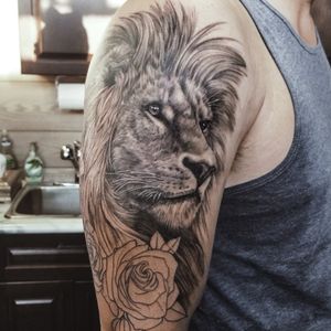 Lion and roses tattoo