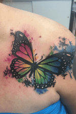 Watercolor butterfly added to a previous tattoo done by someone else. 