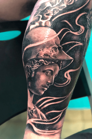 Athena statue on the inner calf!
