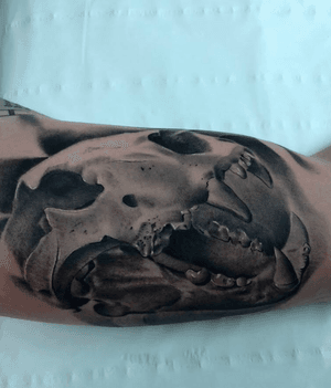Lion skull on the inside of the arm