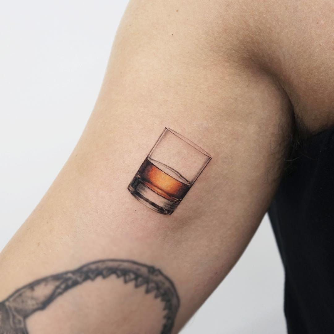 A glass of whiskey and a cigarette tattoo  by Curtis  Maui Tattoo Artist  at MidPacific Tattoo  MidPacific Tattoo