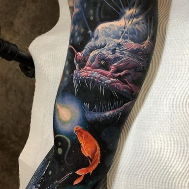Tattoo by Ben Kaye #BenKaye #realismtattoos #hyperrealismtattoos #realism #hyperrealism #realistic #anglerfish #goldfish #deepsea #ocean #color
