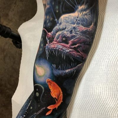 Tattoo by Ben Kaye #BenKaye #realismtattoos #hyperrealismtattoos #realism #hyperrealism #realistic #anglerfish #goldfish #deepsea #ocean #color