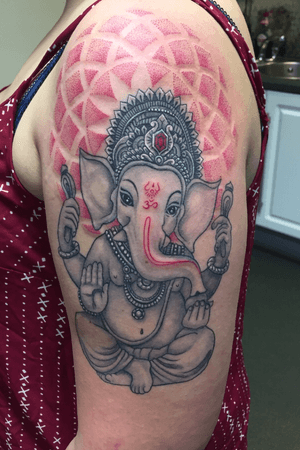 Ganesh statue with dotwork background 