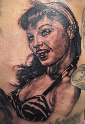 Bettie page on old Tony a rose between a few thorns #pinup #bettiepage #blackandgrey #PortraitRealism #tattooart #tattoooftheday 