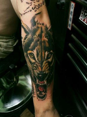 Left forearm.To me, this represents that like a wolf, I'm ready to defend my family to the death. But also, a wolf can be a pack of one. The wolf is alone but not lonely. He is aloof but never afraid of what's ahead.