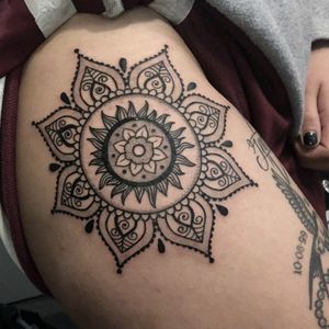 Mandala Sun tattoo.