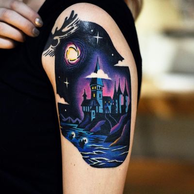 Tattoo by David Cote #DavidCote #DavidPeyote #FantasticBeasts #HarryPotter #JKRowling #HarryPottertattoos #Hogwarts #castle #moon #stars #lake #magic #newschool #color