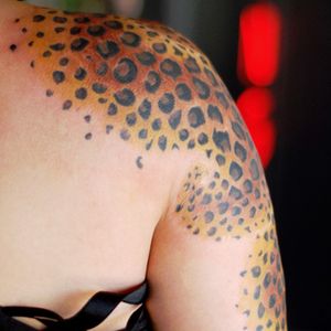 Leopard print shoulder tattoo