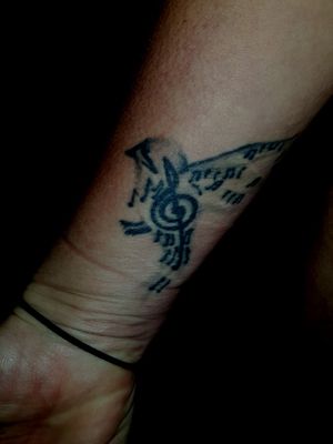 Flying sparrow, with the treble clef and musical notes. It illustrates how music can set you free like a bird. 