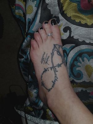 Infinity symbol with the anchor. The writing is my sons name "chayce, i refuse to sink." My love for my son is undying and for infinity. The anchor is to express how in my life he keeps me grounded.  I will never go down in life for too long as I always have him to think about  - I refuse to sink.