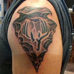 Client wanted an Arrowhead around his deer head design that was already there.