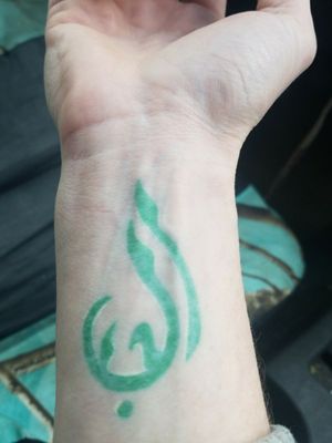 Symbol means Love. Done by an apprentice an needs touched up bad but I still love this green an white no outline Symbol! Also my mom an I got them matching just different colors 😊