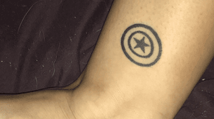 This is tattoo number four, found on my left ankle, it reflects more of my geeky side. But there is still meaning to it. I have always loved Captain America ever since I saw the first Avengers movie. As my love for this character grew, so did my knowledge of him. And it was in that learning that I discovered an inspirational quote. “Doesn't matter what the press says. Doesn't matter what the politicians or the mobs say. Doesn't matter if the whole country decides that something wrong is something right. This nation was founded on one principle above all else: The requirement that we stand up for what we believe, no matter the odds or the consequences. When the mob and the press and the whole world tell you to move, your job is to plant yourself like a tree beside the river of truth, and tell the whole world -- No, you move.” (Fun fact, my best friend went with me for this piece and got a tattoo of Iron Man’s arc reactor! The artist who did the pieces freehanded them!)