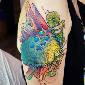 Tattoo by Katie Shocrylas #KatieShocrylas #SciFitattoos #scifi #sciencefiction #Nausicaa #StudioGhibli #ohmu #color #crystals #plants #nature