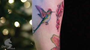 Tiny hummingbird & flowers from her grandma’s garden #tattoocanada #minimalism #coloursplashtattoo #mbyn 