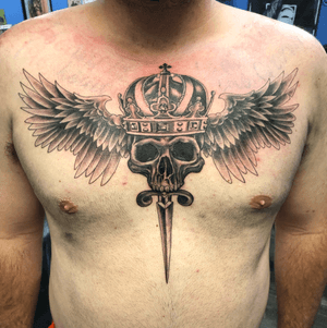 Skull and crown with wings and dagger