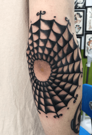 Elbow spider web tattoo
